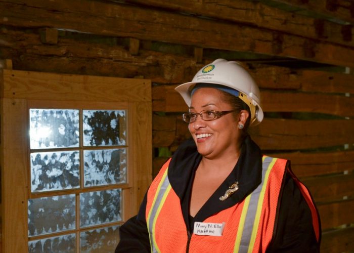  Mary Elliott, curator and museum specialist for the Smithsonian National Museum of African-American History and Culture, pauses next to a slave cabin exhibit during a recent media tour. (Freddie Allen/AMG/NNPA) 