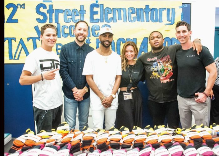 (L-to-R) Roc Nation boxer, Daniel “Twitch” Franco, DJ Reflex, Big Sean, STATE Bags Co-Founder Jacqueline Tatelman, DJ Mustard & STATE Bags Co-Founder Scot Tatelman. Photo By Steve Lucero, (Courtesy Billy Farrell Agency (BFA) )