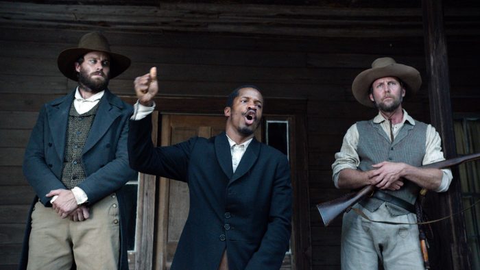 In this image released by Fox Searchlight Pictures, from left, Armie Hammer portrays Samuel Turner, Nate Parker portrays Nat Turner and Jayson Warner Smith portrays Earl Fowler in a scene from "The Birth of a Nation," opening Oct. 7, 2016. (Fox Searchlight Pictures via AP)