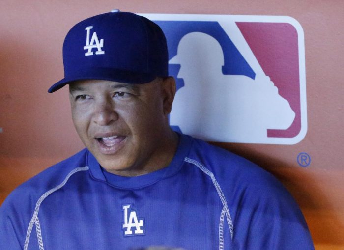 Los Angeles Dodgers manager Dave Roberts speaks to members of the media before the start of a baseball game against the Miami Marlins, Saturday, Sept. 10, 2016, in Miami. (AP Photo/Wilfredo Lee)