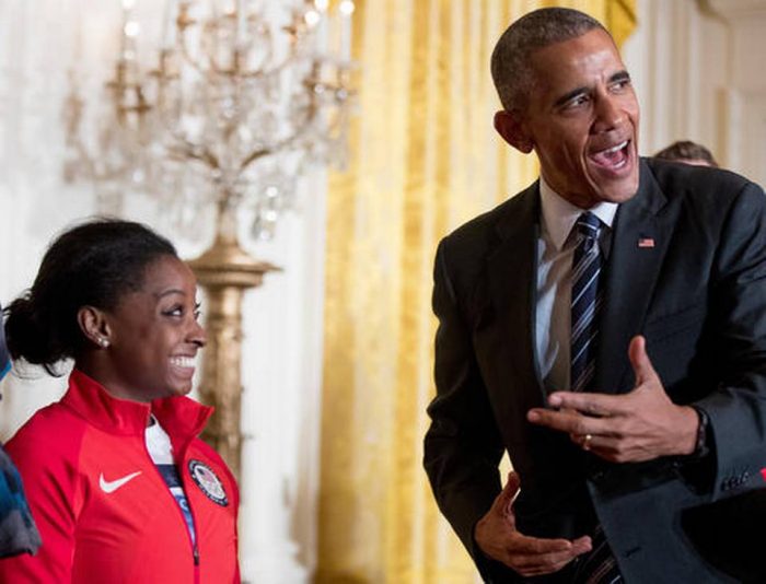  President Barack Obama leans over to speak to US Olympics gymnast Simone Biles in the East Room the White House in Washington, Thursday, Sept. 29, 2016, during a ceremony where he honored members of the 2016 United States Summer Olympic and Paralympic Teams. (Andrew Harnik/ AP Photo)  