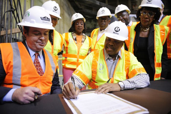  (L-R) Daniel P. Walsh, president of Walsh Shea Construction and Metro CEO Phil Washington signed a proclamation saying they would complete the project by 2019 or possibly sooner. (Photo by Valerie Goodloe)  