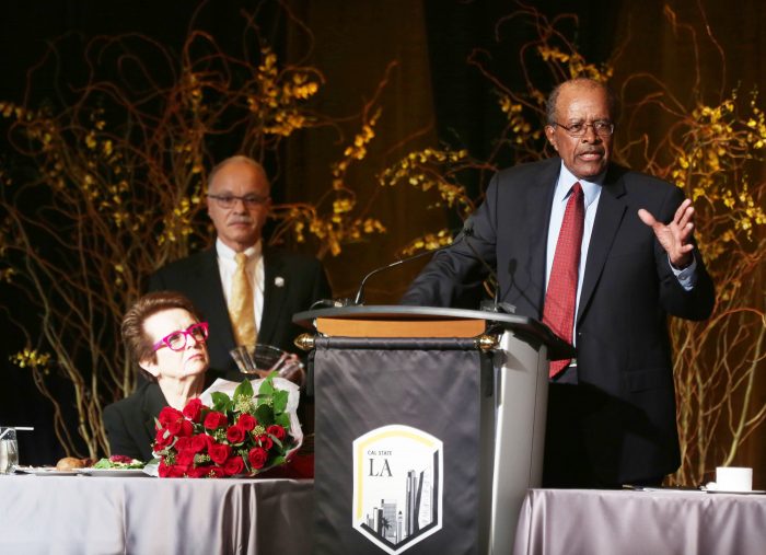 Right to left, James M. Rosser, President William A. Covino, and Billie Jean King (seated) during the Billie Jean King & Friends Event. (Credit: J. Emilio Flores/Cal State LA)