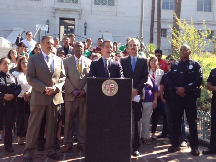 LAPD Chief Charlie Beck, shown here with Councilman Curren Price and Mayor Eric Garcetti, said he doesn’t intend on doing “anything different” when it comes to immigration policies, despite President Elect Donald Trump’s pledge to deport millions of illegal immigrants. (file photo) 