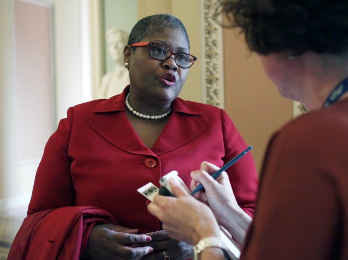 Melanie Campbell, president, National Coalition on Civic Participation, speaks to a reporter on Capitol Hill in Washington, Wednesday, April 15, 2015, as a group of civil rights and religious leaders protested the delay of a vote to confirm Loretta Lynch to be Attorney General outside the office of Senate Majority Leader Mitch McConnell of Ky.  (AP Photo/Lauren Victoria Burke)