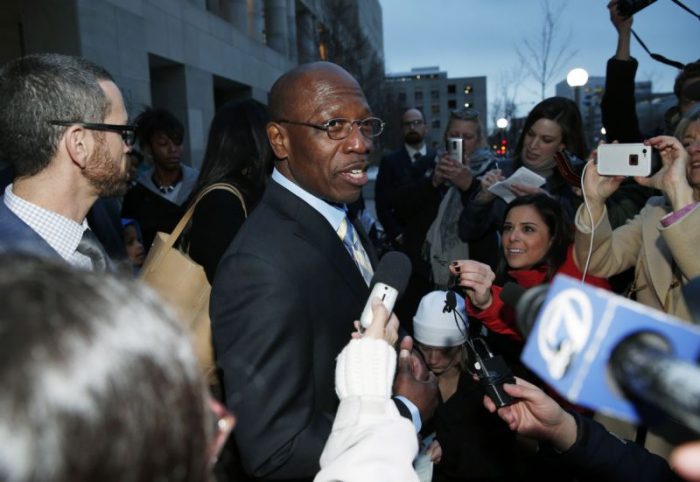  In this Dec. 22, 2015, file photo, Clarence Moses-EL, center, talks after being released from Denver County jail in Denver. Moses-EL, released from prison last year after spending more than a quarter of a century in prison for a rape he long denied committing, was acquitted of the crime on Monday, Nov. 14, 2016, leaving a courtroom to applause from supporters and chants of "it's over." (AP Photo/David Zalubowski, File) 