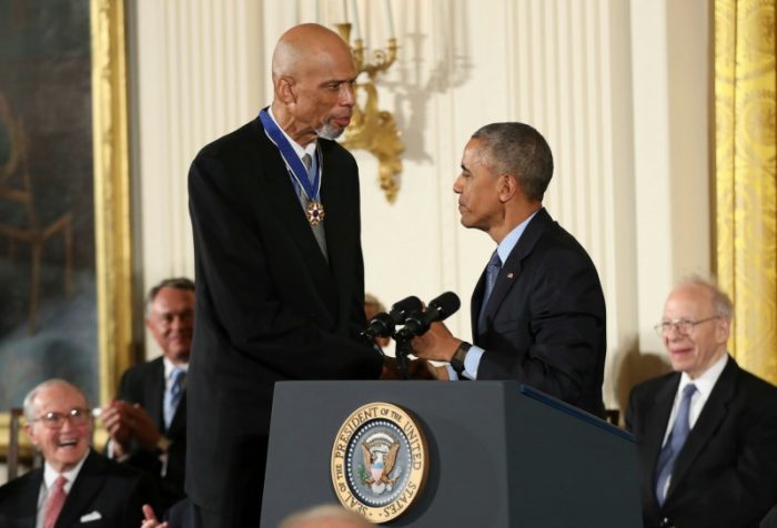 ormer NBA basketball player Kareem Abdul Jabbar, left, is presented the Presidential Medal of Freedom by President Barack Obama, right, during a ceremony in the East Room of the White House, Tuesday, Nov. 22, 2016, in Washington. Obama is recognizing 21 Americans with the nation's highest civilian award, including giants of the entertainment industry, sports legends, activists and innovators. (AP Photo/Andrew Harnik) 