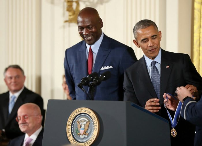 President Barack Obama presents the Presidential Medal of Freedom to former NBA basketball player Michael Jordan during a ceremony in the East Room of the White House Tuesday, Nov. 22, 2016, in Washington. Obama is recognizing 21 Americans with the nation's highest civilian award, including giants of the entertainment industry, sports legends, activists and innovators. (AP Photo/Manuel Balce Ceneta) 