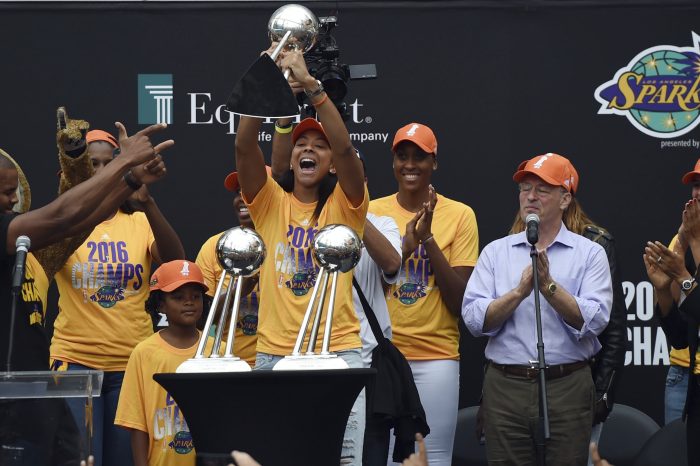 Los Angeles Sparks' Candace Parker holds the WNBA Championship trophy during a celebration to honor their winning at Chick Hearn Court at LA Live in Los Angeles, Monday, Oct. 24, 2016. (Hans Gutknecht/Los Angeles Daily News via AP)