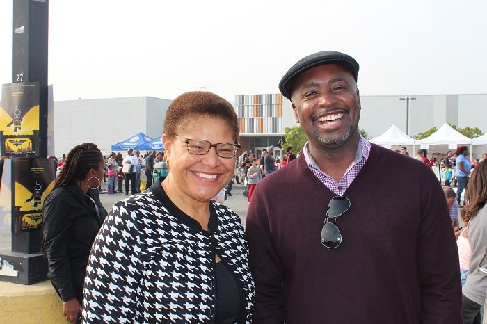 Holiday Cheer: Councilmember  Harris-Dawson and Congressmember Karen Bass smile for the camera as they bring Christmas festivities to South LA children. (Courtesy Photo)