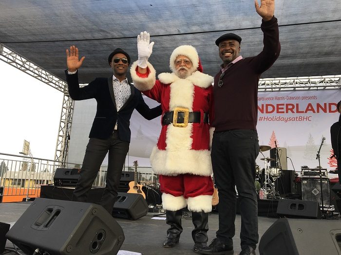 Santa came to town: Councilmember, Santa Claus, and Aloe Blacc cheer on the Crenshaw community. (Courtesy Photo)