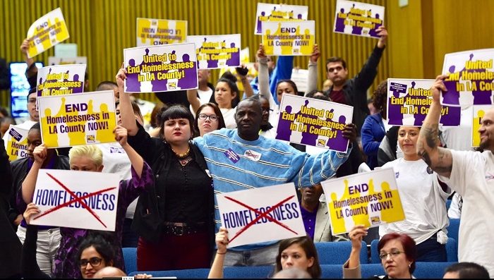 Activists demonstrate during a recent L.A. County Board of Supervisors meeting