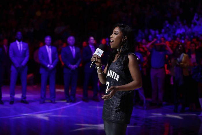 Sevyn Streeter sings the national anthem before an NBA basketball game between the Philadelphia 76ers and the Los Angeles Lakers, Friday, Dec. 16, 2016, in Philadelphia. (AP Photo/Matt Slocum)