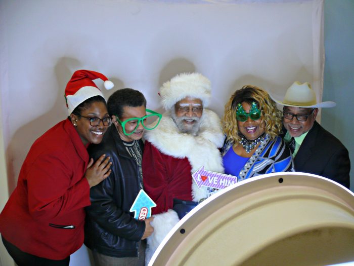 Santa drops in on the Joint Holiday Mixer at BHCP for a little cheesecake with guests (Photo by Brian W. Carter)