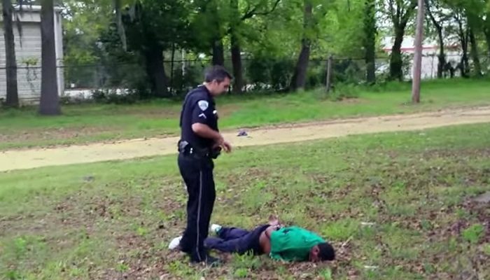 North Charleston Officer Michael Slager stands over Walter Scott's body after shooting him in the back following a traffic stop. (Screenshot/YouTube.com)