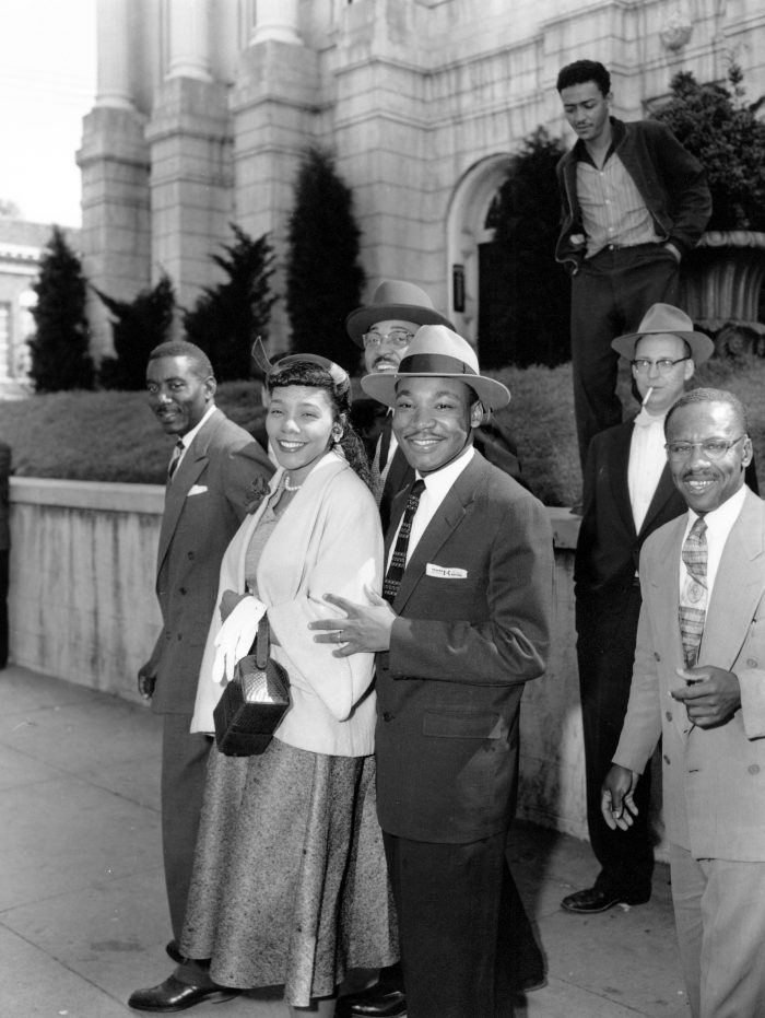 Rev. Dr. Martin Luther King Jr., and his wife, Coretta, are shown outside Circuit Court in Montogomery, Al. on March 22, 1956. The Reverend was found guilty of conspiring the Montgomery Bus Boycott that began Dec. 5, 1955. The others are not identified. (AP Photo/Gene Herrick)