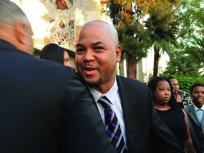 Dustin Bingham: Howard Bingham’s son, Dustin, greets people attending the service. (Valerie Goodloe photo)