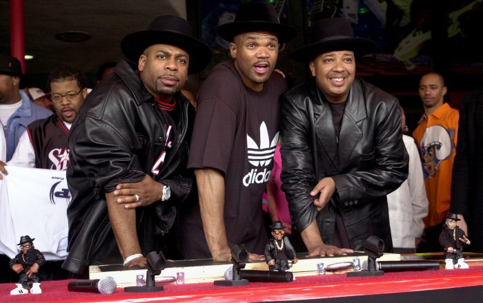 Hip hop pioneers RUN-DMC create handprints in cement as they are  inducted into Hollywood's RockWalk Monday, Feb. 25, 2002, in Los Angeles. Jason "Jam Master Jay" Mizell, left, Darryl "DMC" McDaniels, center, and Joseph "DJ Run" Simmons, produced the first rap album to go gold as well as the first rap act nominated for a Grammy. (AP Photo/Krista Niles)