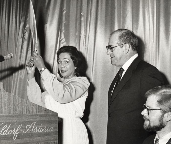 Coretta Scot King stands at the podium beside Murray H. Finley during the Americans for DEmocratic Action Roosevelt-Humphrey Dinner on June 16, 1983 at the Waldord Astoria Hotel in New York City (Ron Gabella/ Wire Image