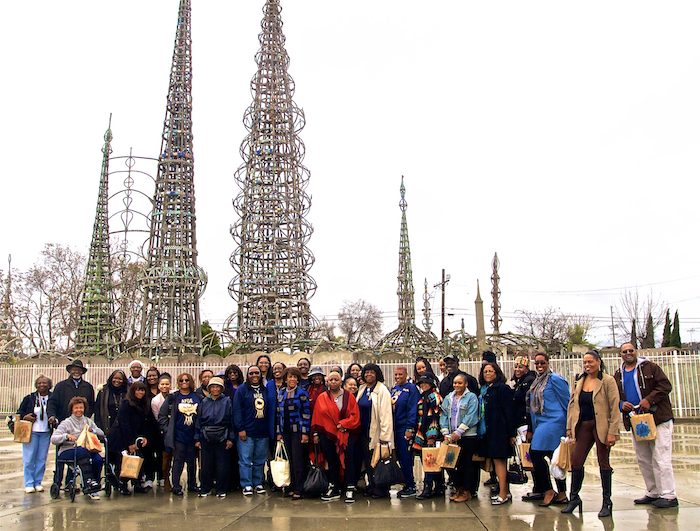 1-Congresswoman Maxine Waters and participants of the Black History Month Museum / Art Gallery Tour, stand in unison, in front of the historical Watts Towers, Saturday, February 19, 2017. (Photo by E. Mesiyah McGinnis for LAWT) 