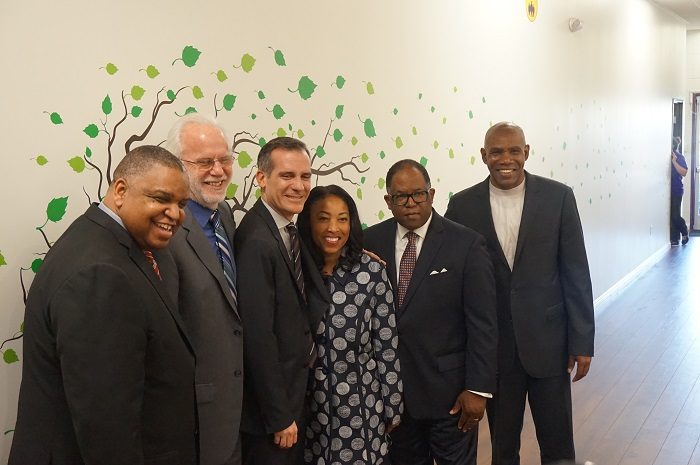 (From Left-to-Right): Pastor John Cager, Board Chair of First to Serve, Kevin McCardle, Board Chair of St. Joseph Center, Mayor Eric Garcetti, Va Lecia Adams Kellum, President & CEO of St. Joseph Center, Mark Ridley Thomas, L.A. County Supervisor and Rev. Richard Reed, Executive Director of First to Serve. Photo By Brian W. Carter