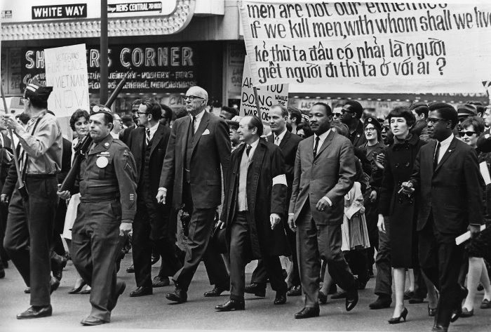 Leading the march against the Vietnam conflict are Dr. Benjamin Spock, tall, white-haired man, and Dr. Martin Luther King Jr., third from right, in a parade on State St. in Chicago, Ill., March 25, 1967.  Dr. Spock is co-chairman of the National Committee for Sane Nuclear Policy.  (AP Photo)