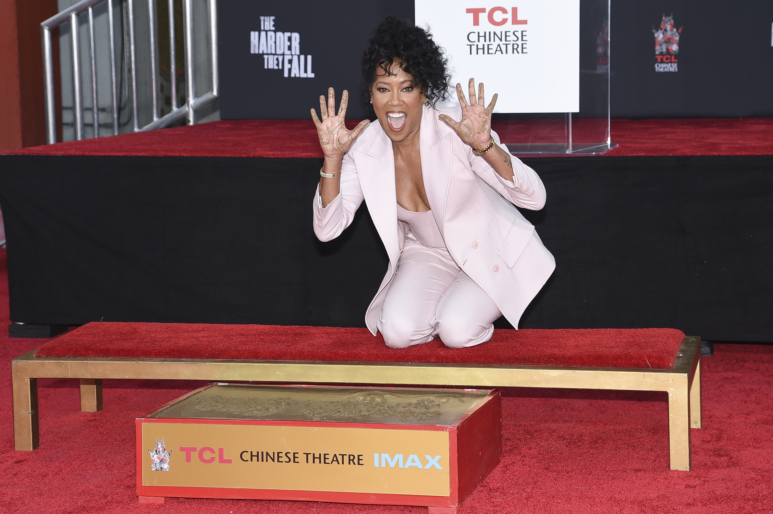 Regina King Places Handprints, Footprints Outside TCL Chinese Theatre